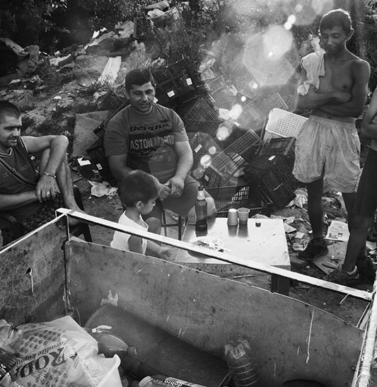 7/26-2015. Belgrade,Serbia. 
Many stateless Roma displaced from Kosovo simply cannot afford to go through the time-consuming, expensive process of applying for birth registration and citizenship documents. Some don't even know they can apply.
The main problem is proving that his parents had citizenship and providing evidence of a formal residence, without which he cannot obtain an ID card and enjoy the full rights of citizenship. In a 2015 survey, UNHCR found about 3,578 Roma in Serbia did not have birth registration documents or personal documentation. Berisa Siribana , Aleksandar Ikonic and Robert Selmovice have waiting for the boy in the trolley Berisha Siribana 3 years sleeping after his sister have been out in town an collecting bottles.